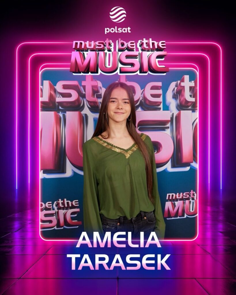 Smiling young woman in a green blouse stands before a pink neon frame backdrop with 'Must Be the Music' branding and 'AMELIA TARASEK' text at the bottom; Polsat logo above.